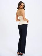 Yani Ivory Asymmetrical Lapel Sleeveless Peplum Top